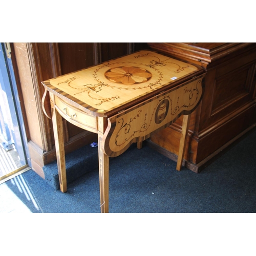 521 - Continental inlaid marquetry drop leaf table. 75cm in height.