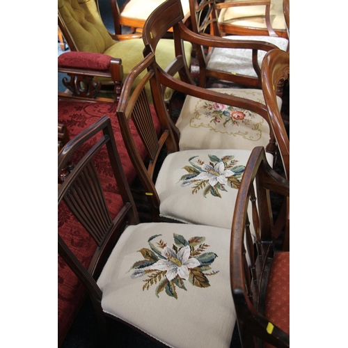 534 - An Edwardian armchair together with two Edwardian hall chairs.