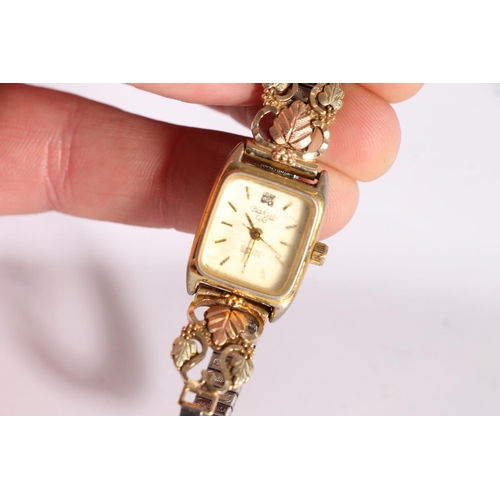 431 - Black Hills diamond quartz ladies wristwatch on 10ct gold shoulders and plated strap