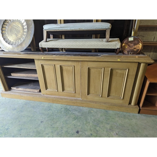 480 - Large scumbled pine cabinet bookcase, the break front top fitted with four glazed doors above cabine... 