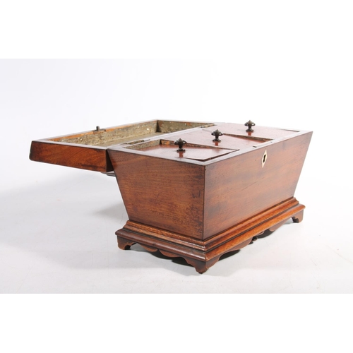 12 - Antique mahogany sarcophagus shaped tea caddy, the hinge top opening to reveal triple division inter... 