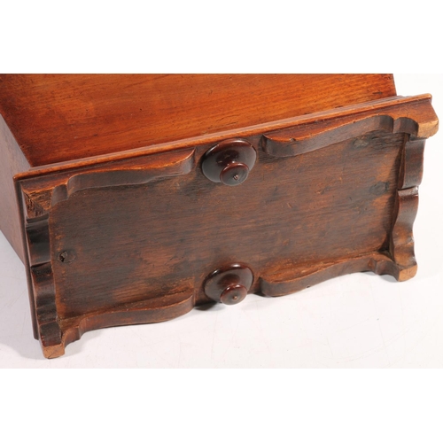 12 - Antique mahogany sarcophagus shaped tea caddy, the hinge top opening to reveal triple division inter... 