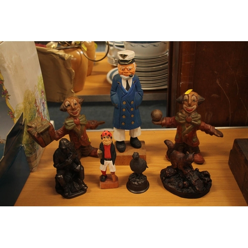 141 - Painted treen and other metal figurines.