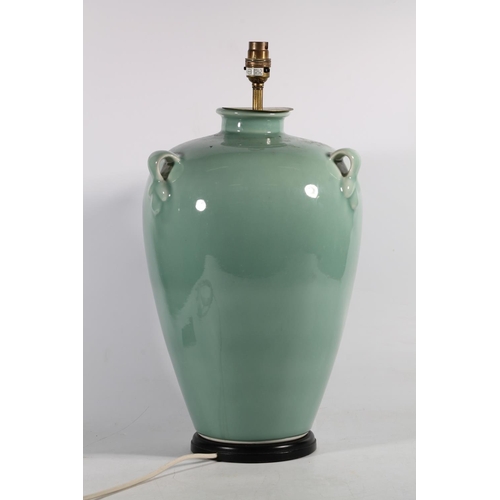 148 - Green glazed pottery lamp base, 51cm high.