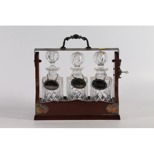 159 - Mahogany and metal framed three bottle tantalus.