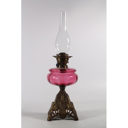 161 - Late Victorian oil lamp with ruby glass reservoir.