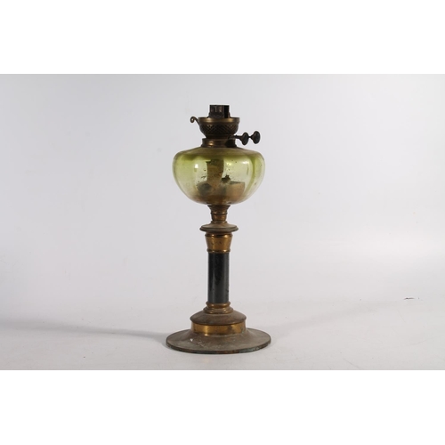 165 - Brass and green glass oil lamp.