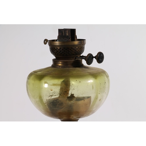 165 - Brass and green glass oil lamp.