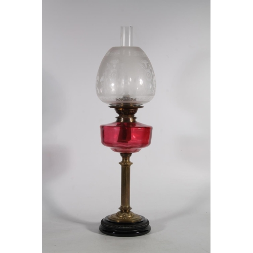 170 - Late 19th century brass oil lamp with cranberry glass reservoir.