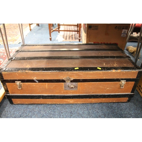 194 - Wooden bound travel trunk.