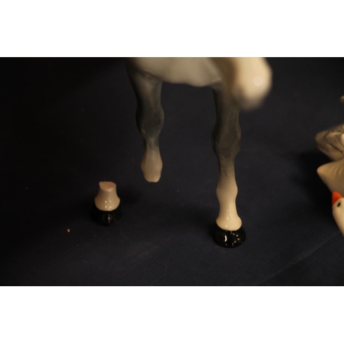 28 - Beswick model of a dapple grey horse, 25cm long, a Lladro figurine of a lady dancer, 30cm high, a Hu... 