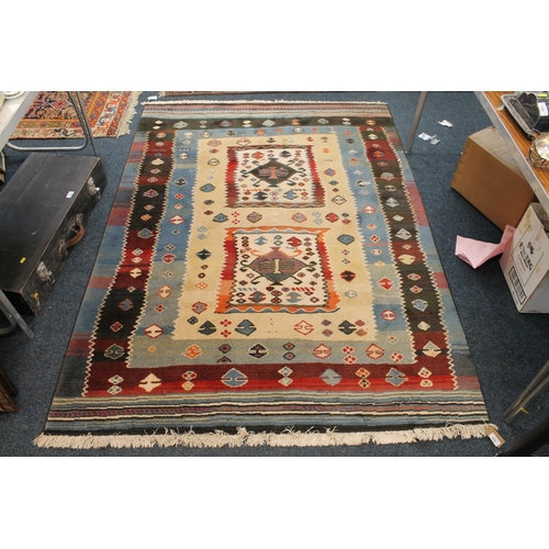 335 - Tribal wool rug, 186cm x 140cm.