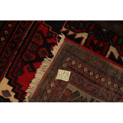 337 - Afghan red background prayer rug, 128cm x 72cm.