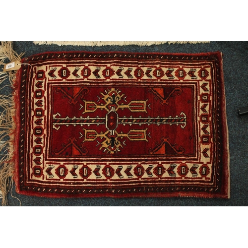 338 - Turkish small rug/saddle rug, 75cm x 52cm.