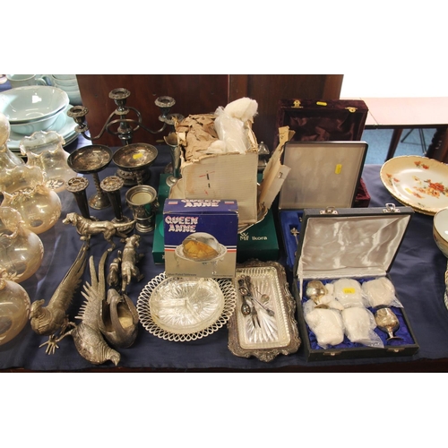 62 - Decorative silver-plate to include candlesticks, figurines, cups, souvenir spoons, etc.