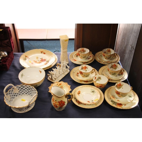 63 - Continental porcelain to include French poppy decorated part teasets, a Belleek vase, etc.