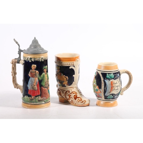 82 - German pottery stein with similar pottery boot vase and a similar small tankard.