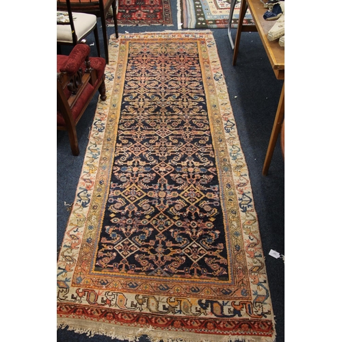 333 - Caucasian runner with geometric borders and blue ground centre, 293cm x 105cm.