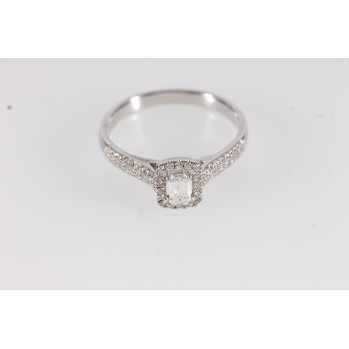 103 - 18ct white gold and diamond ring, the centre scissor cut stone within a rectangle of round brilliant... 