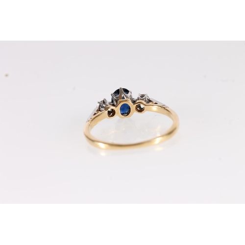 111 - 1930s 18ct gold sapphire and diamond ring, the oval cut sapphire flanked by round cut diamonds, on a... 