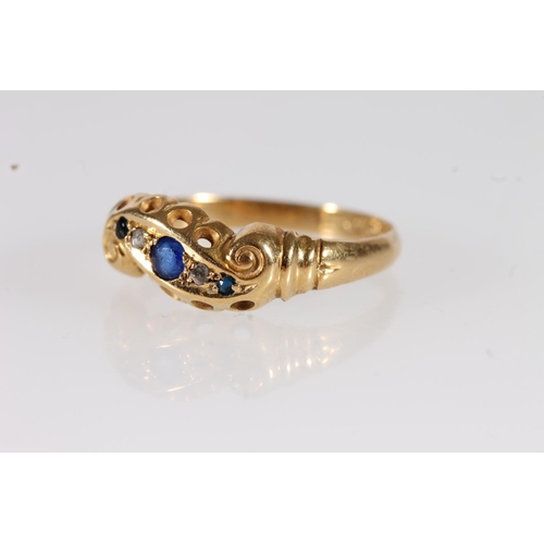 114 - c1920s 18ct gold and sapphire crossover ring, the three sapphires interspersed by diamond chips on s... 