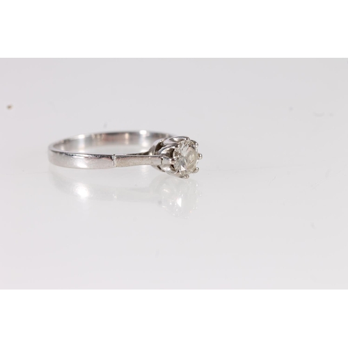 117 - White metal and diamond solitaire ring, the central brilliant cut diamond in eight claw collet setti... 