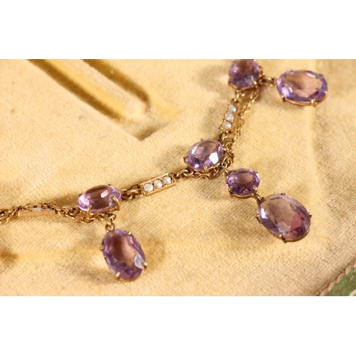 119 - Edwardian amethyst and split pearl necklace, the oval and round cut amethysts suspended on a fine ye... 