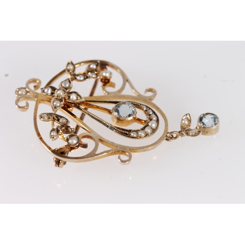 123 - Edwardian 9ct gold Art Nouveau pendant brooch, the round cut aquamarines and seed pearls on a gold o... 