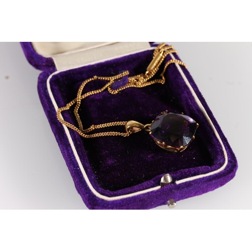 125 - Early 20th century amethyst pendant, the cushion cut amethyst measuring 14mm x 14mm, on a yellow met... 