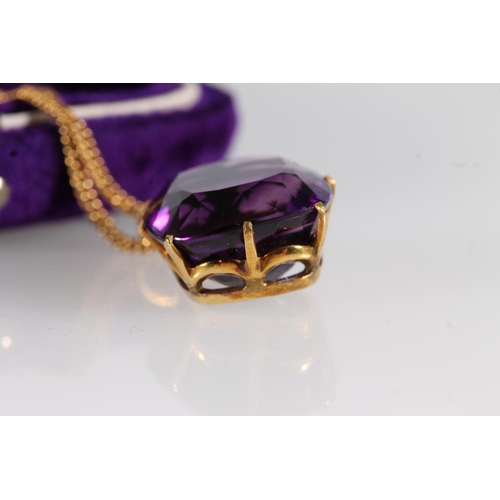 125 - Early 20th century amethyst pendant, the cushion cut amethyst measuring 14mm x 14mm, on a yellow met... 