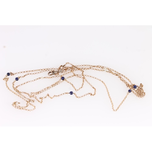 128 - Early 20thC 9ct gold rope chain necklace, the links interspersed with small pearls and blue stones, ... 