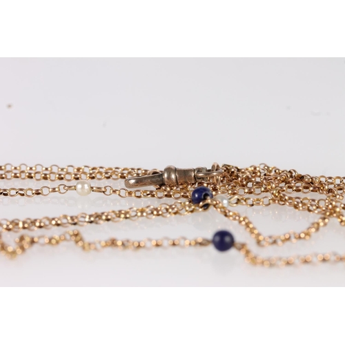 128 - Early 20thC 9ct gold rope chain necklace, the links interspersed with small pearls and blue stones, ... 