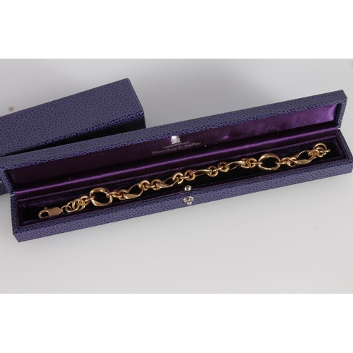 130 - 18ct gold fancy link bracelet with 9ct gold clasp, gross 41.7g, in purple Hamilton and Inches of Edi... 