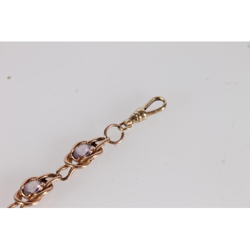 133 - Edwardian 9ct gold knotwork bracelet, set with oval amethyst coloured stones within double knotted l... 