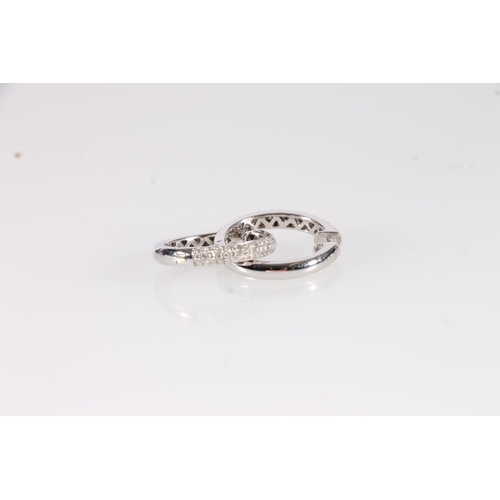 141 - Pair of 18ct white gold and diamond hoop earrings, the hinged hoops set with a triple row of pave se... 