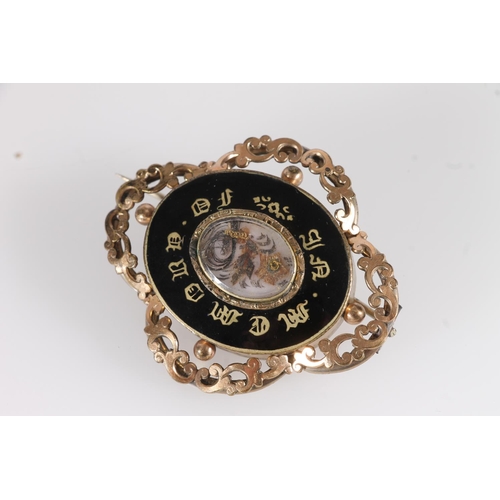 145 - Victorian mourning brooch, the central glazed panel holding a sprig of woven hair within black ename... 