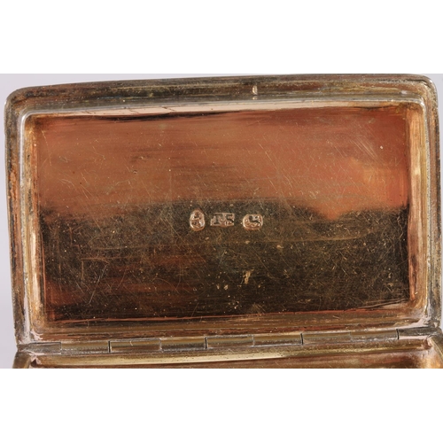 28 - Georgian antique silver snuff box of rectangular form with embossed foliate borders and gilded inter...