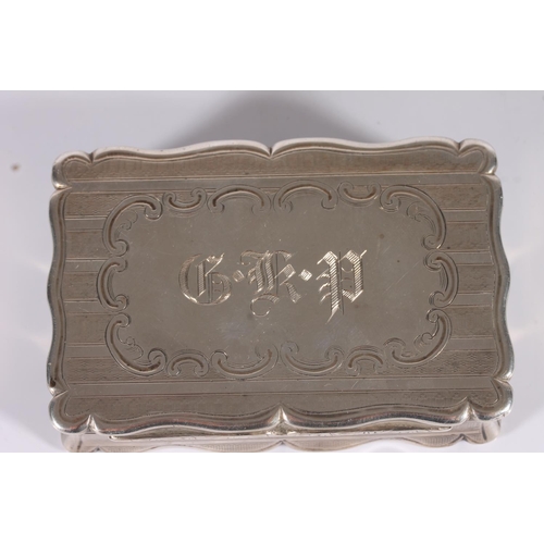 35 - Victorian antique silver snuff box of rectangular form with serpentine edge, the body with engine tu...