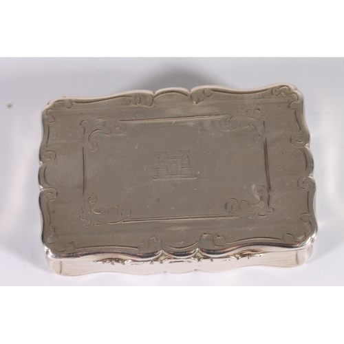 38 - Victorian antique silver snuff box of rectangular shape with serpentine scroll border rim, incised a...