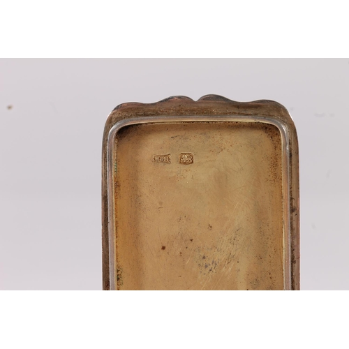 44 - George VI silver snuff box of rectangular form with plain top and bottom surfaces and relief leaf de...