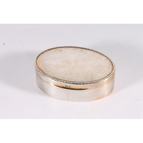 47 - Edwardian antique silver tobacco box of oval shape with relief border rim, gilded interior, by Synye...