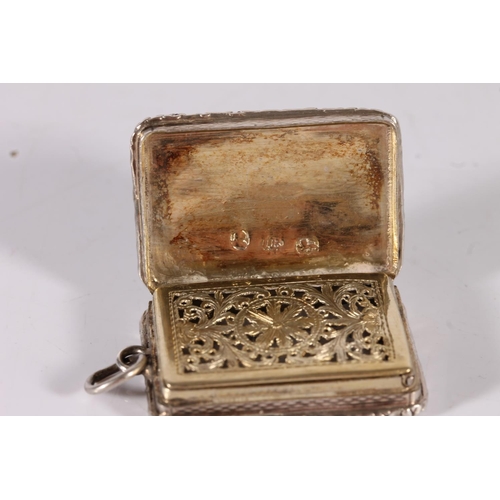 60 - Victorian antique silver vinaigrette of rectangular form with engine turned decoration and relief em...