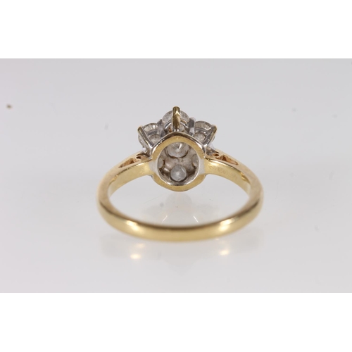 87 - 18ct yellow gold and diamond cluster ring, the seven round brilliant cut stones measuring approx. 1.... 