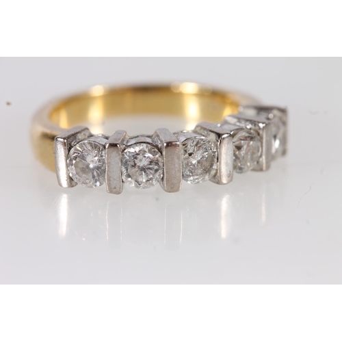 89 - 18ct yellow gold and five stone diamond ring, the round brilliant cut diamonds in a white gold bar s... 