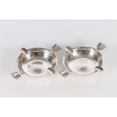9 - Pair of silver ashtrays by Cecil R Walker, London, 1936, 153g gross, 12cm across the handles. (2)...