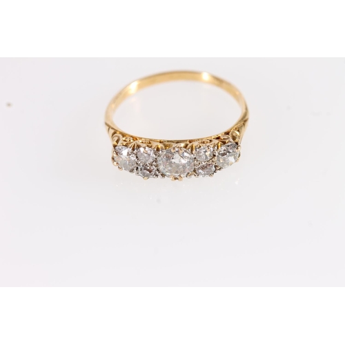 92 - Edwardian 18ct gold and seven diamond ring, the seven round cut graduating stones approx. 0.9 to 1.0... 