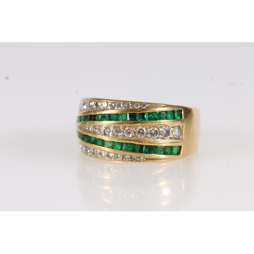 96 - Modernist 18ct gold diamond and emerald ring, the graduated diamonds and emeralds pave and channel s... 