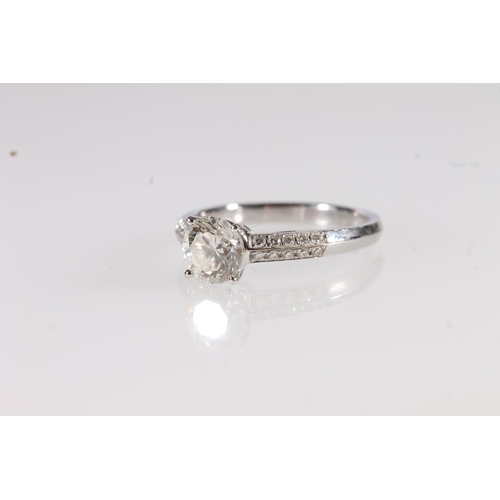 97 - 18ct white gold diamond solitaire ring, the round cut brilliant diamond centre stone flanked by twin... 