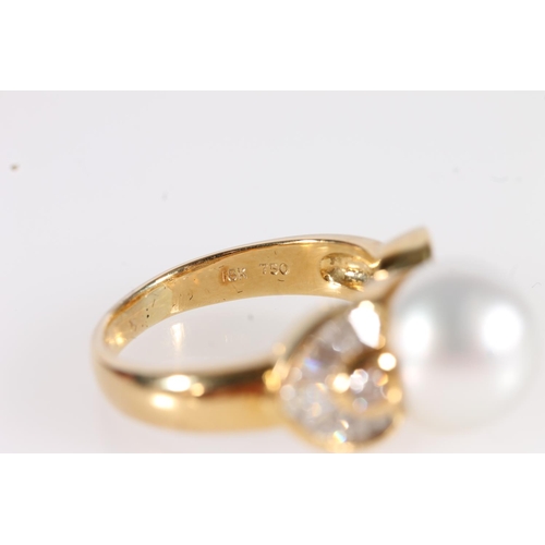 98 - 18ct gold solitaire pearl and diamond ring, the Japanese pearl flanked by tapered square diamonds in... 