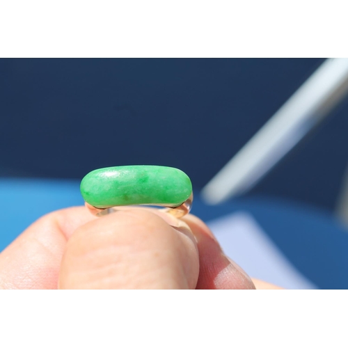 374 - Jadeite ring with curved cabochon, inscribed and dated 1933, probably 14ct gold, size M.